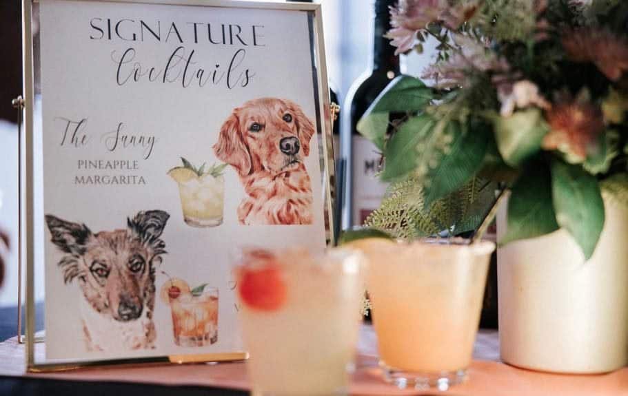 A refreshing Pineapple Margarita served at Sunny Cups Coffee, featuring a cute dog illustration on t.