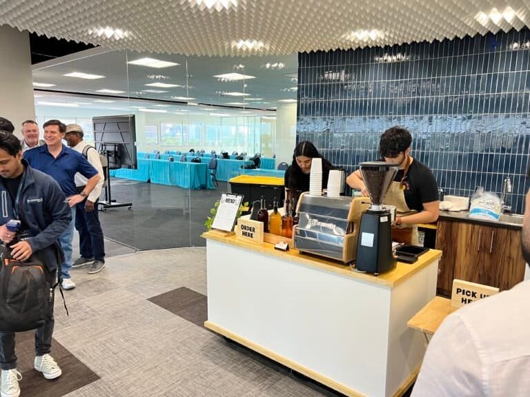 Baristas preparing fresh coffee at Sunny Cups Coffee counter.