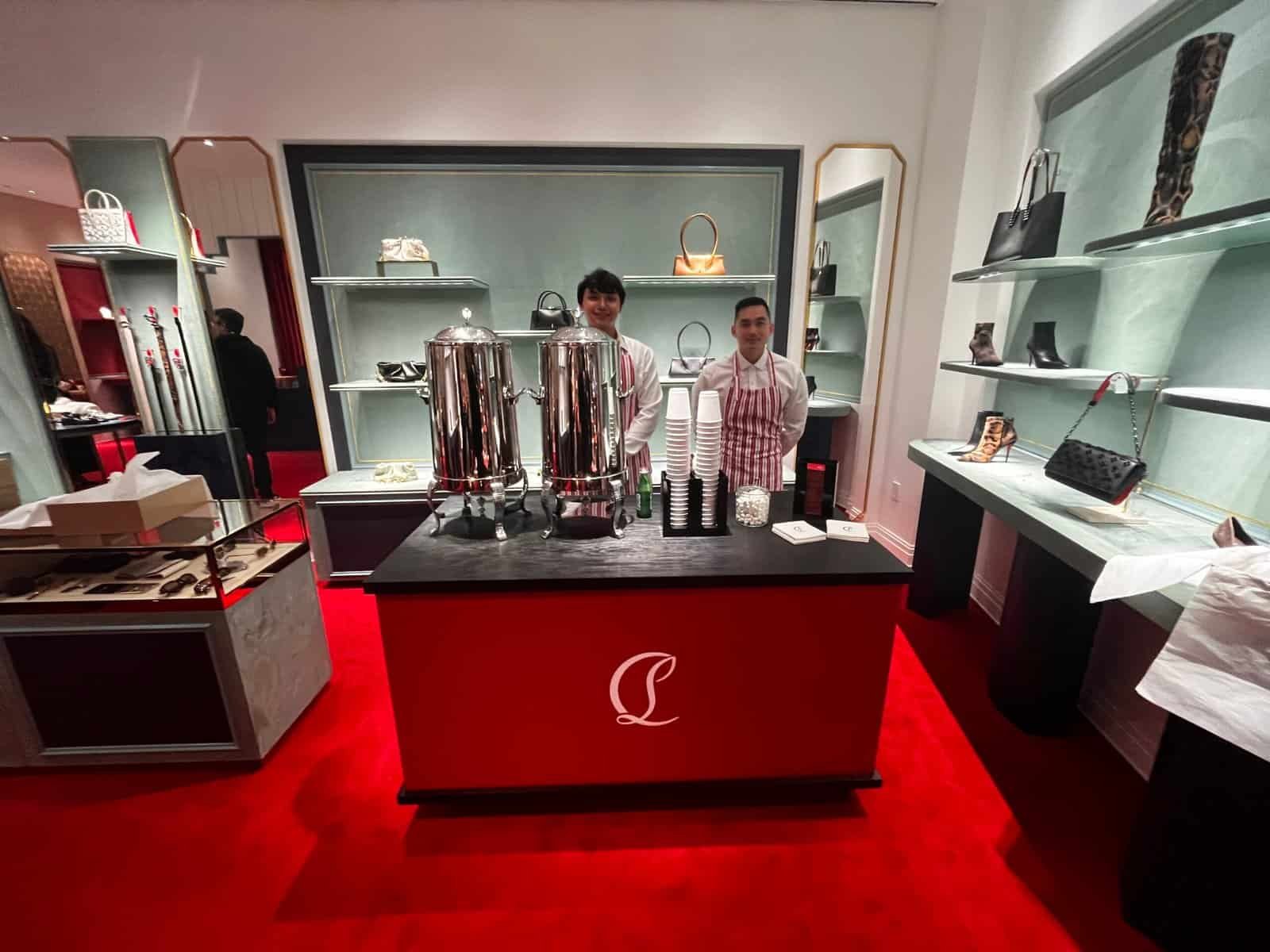 Charming coffee station with baristas preparing beverages in a stylish retail setting.