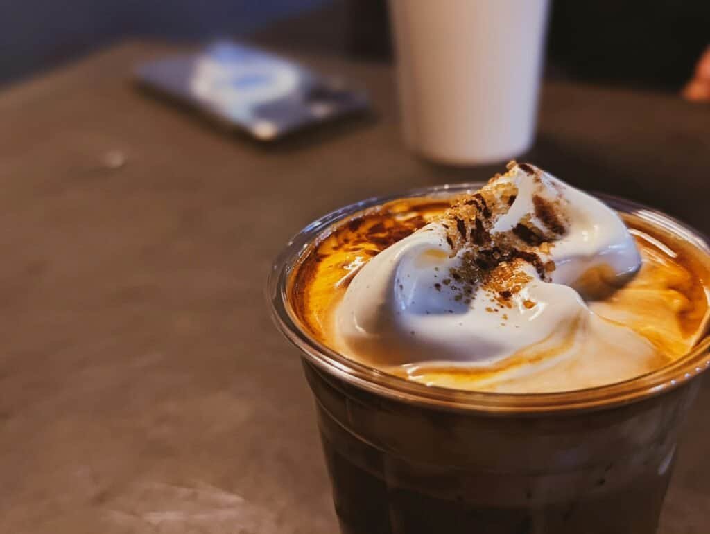 Delicious caramel mocha coffee topped with whipped cream and cinnamon.
